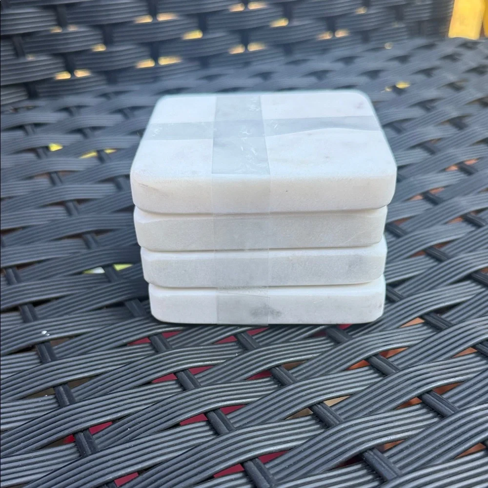 Stack of White Square Marble Coasters